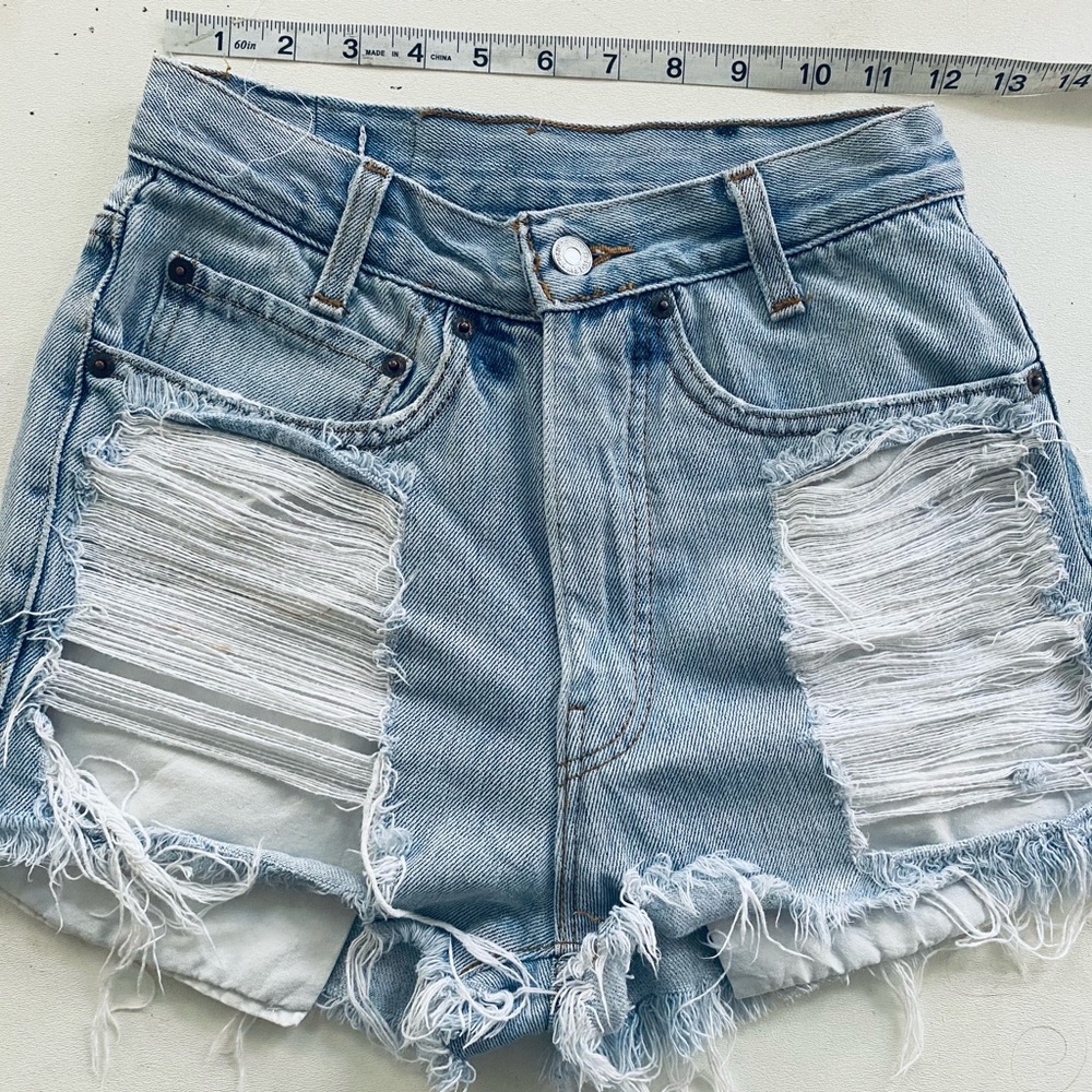 Professionally altered super cute high waisted Levi’s Jean shorts.